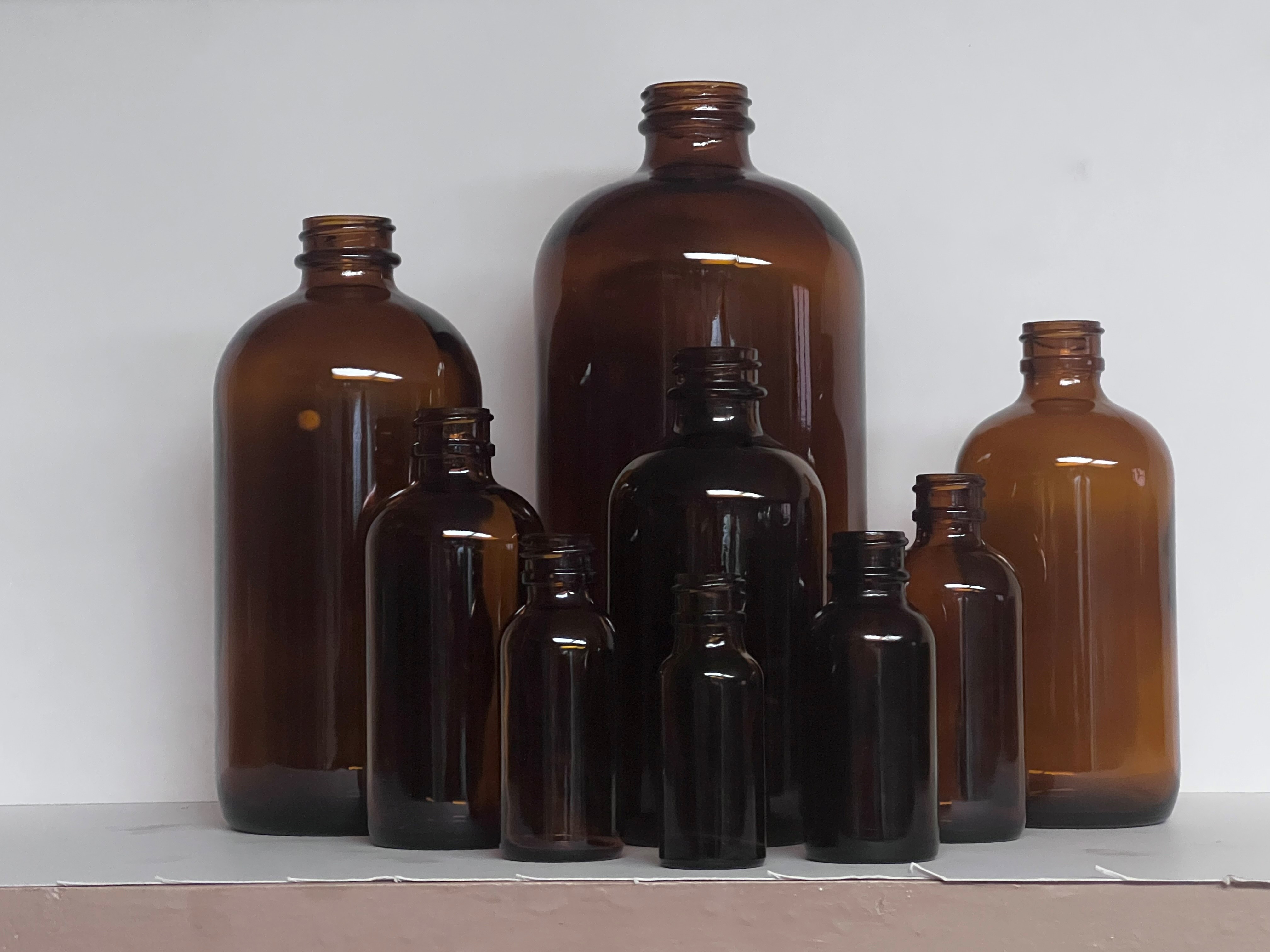 Amber Boston round glass bottles