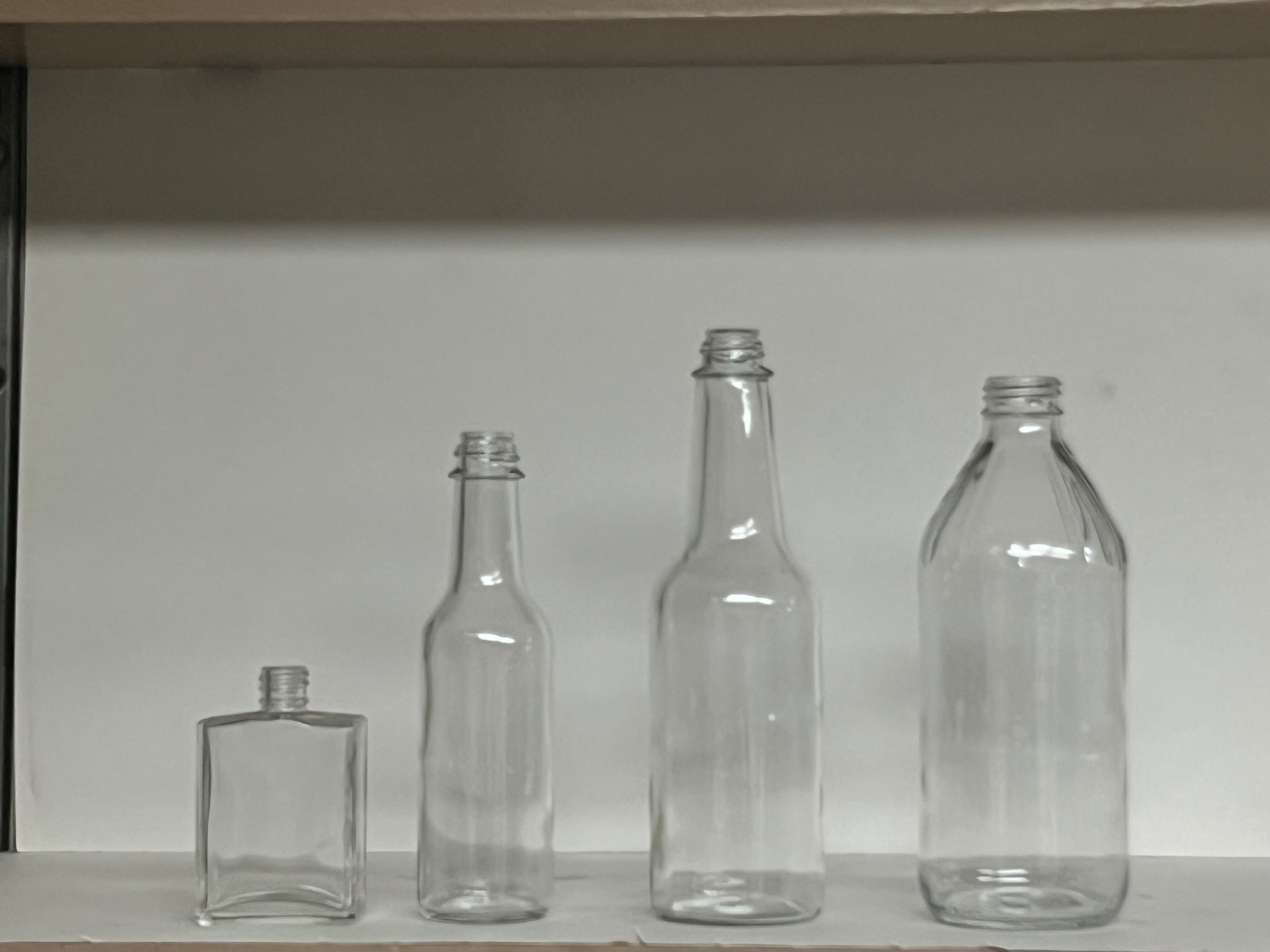 Woozy and Phoenix glass bottles